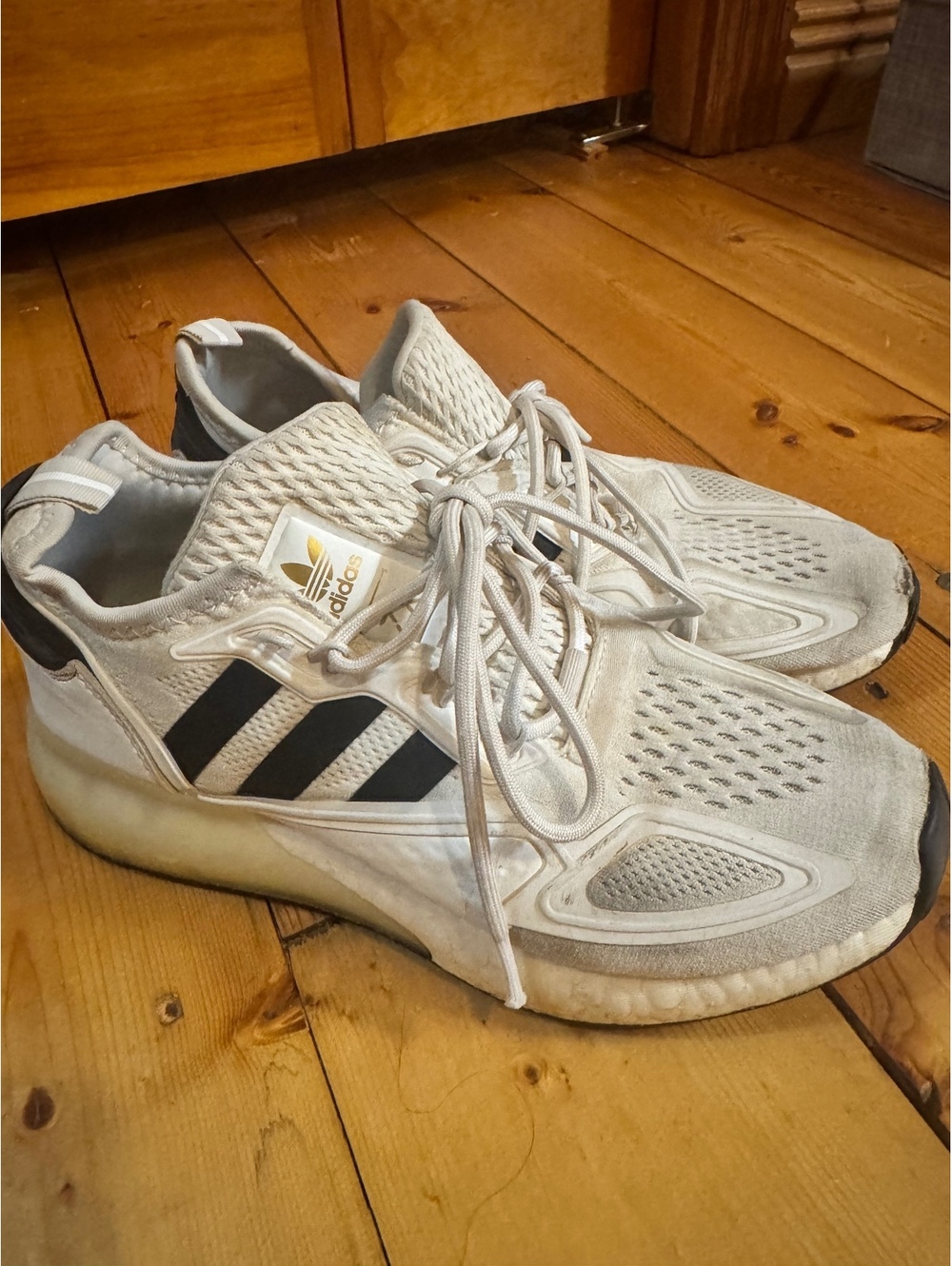 Adidas white and gray sneakers with black stripes